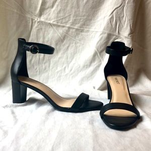 Nine West black ankle strap heels.